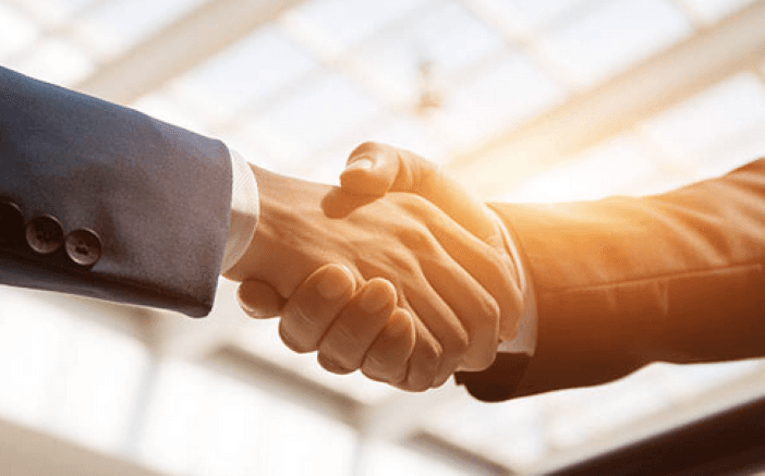 Business partners shaking hands